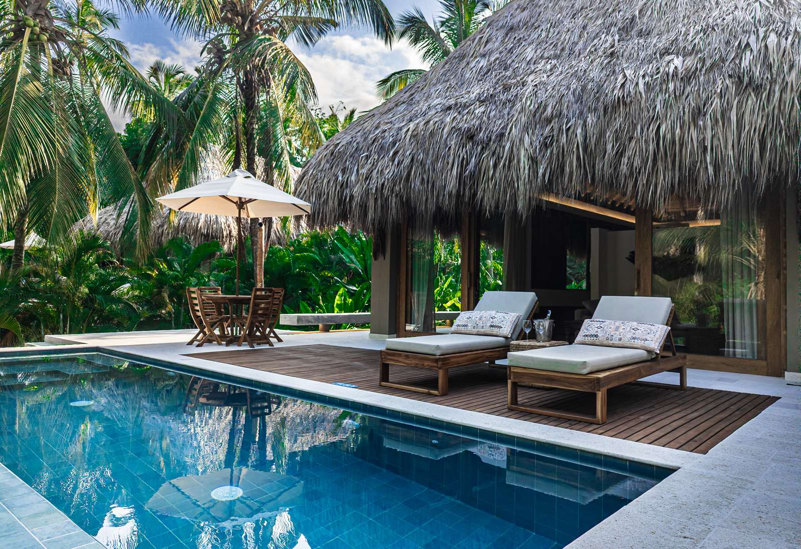 Villa pool terrace with loungers