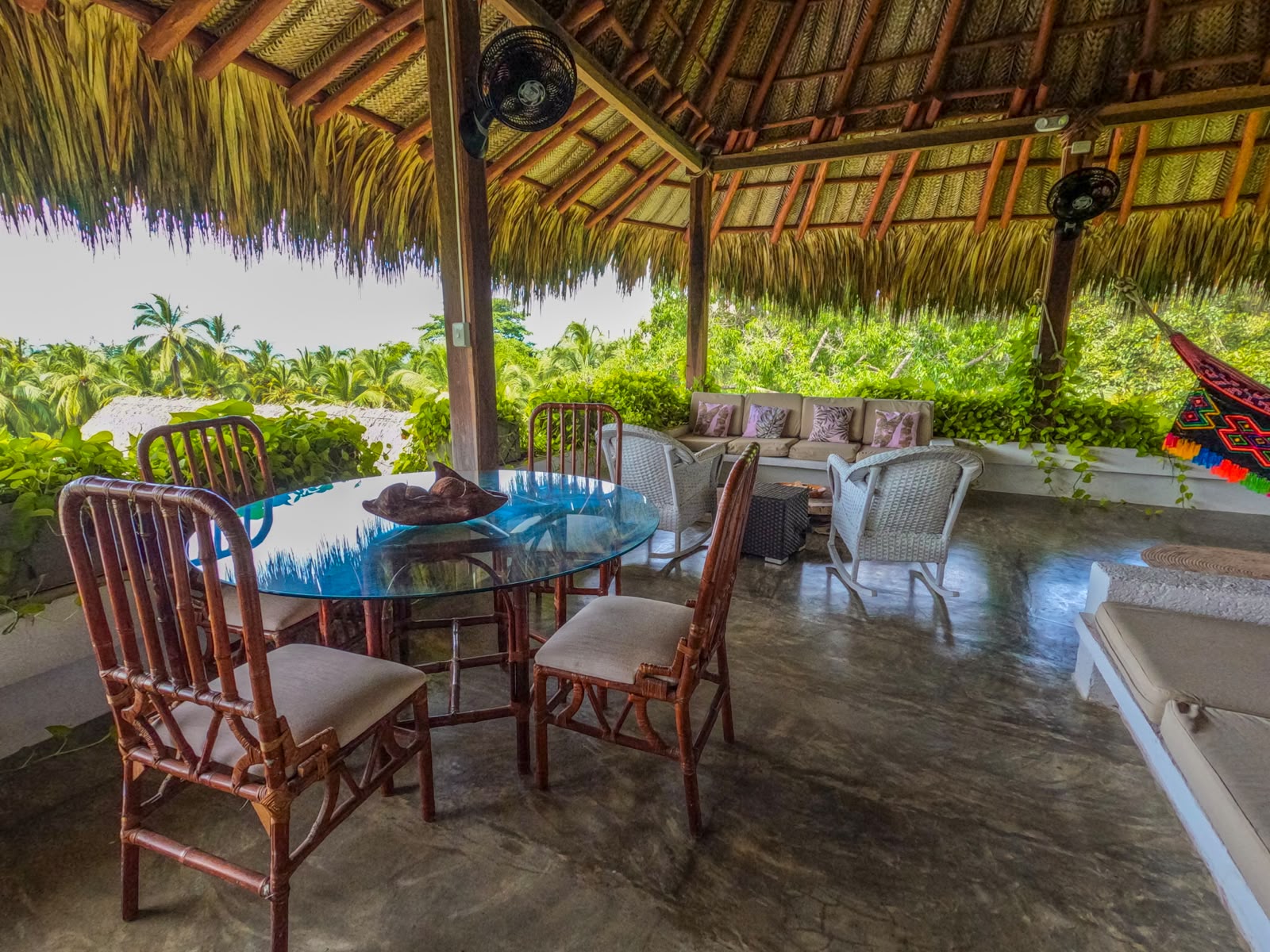 Dining under the thatched terrace