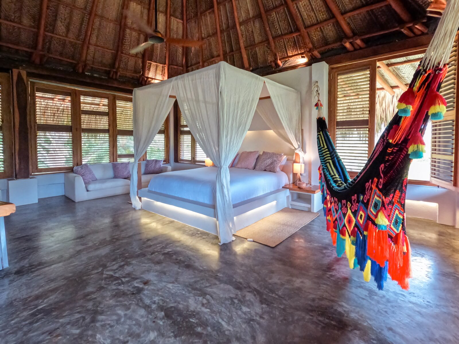 Suite with canopy bed and hammock