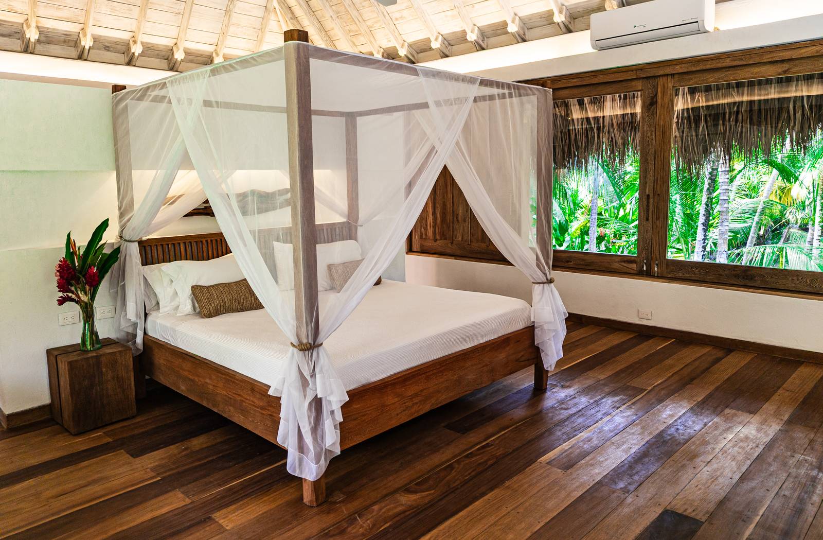 Villa bedroom with canopy king bed